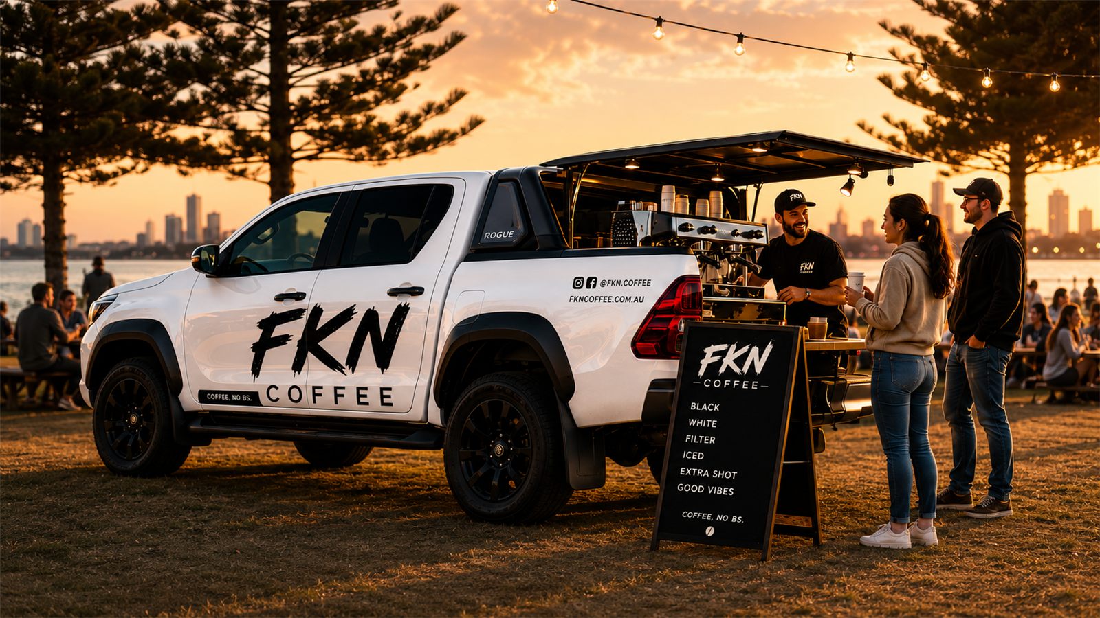 The FKN Coffee rig set up at a waterfront event, golden hour
